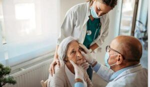 Elderly woman being examined by a doctor