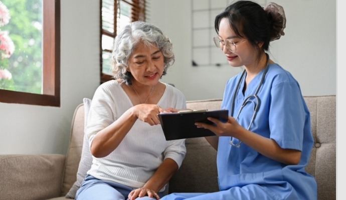 Woman reviewing documents with her doctor